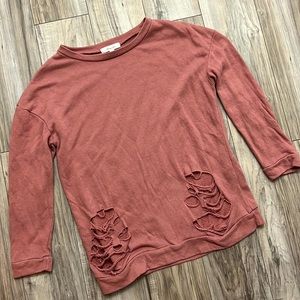 Cutest sweater with tears at bottom